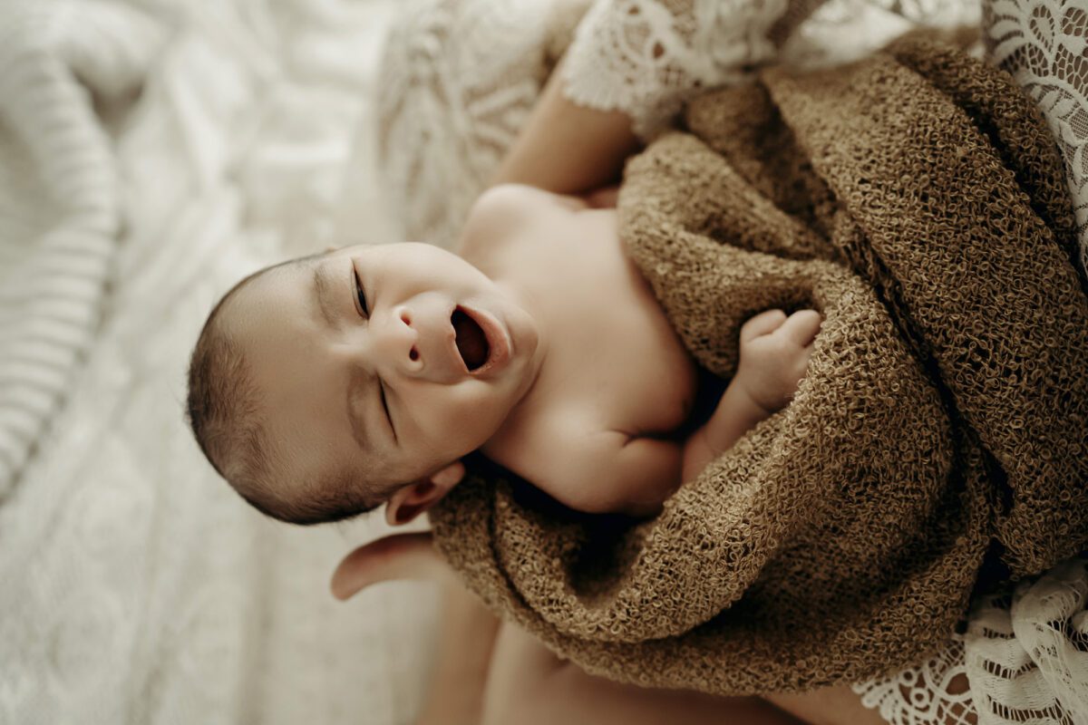 newborn photoshoot candid moment