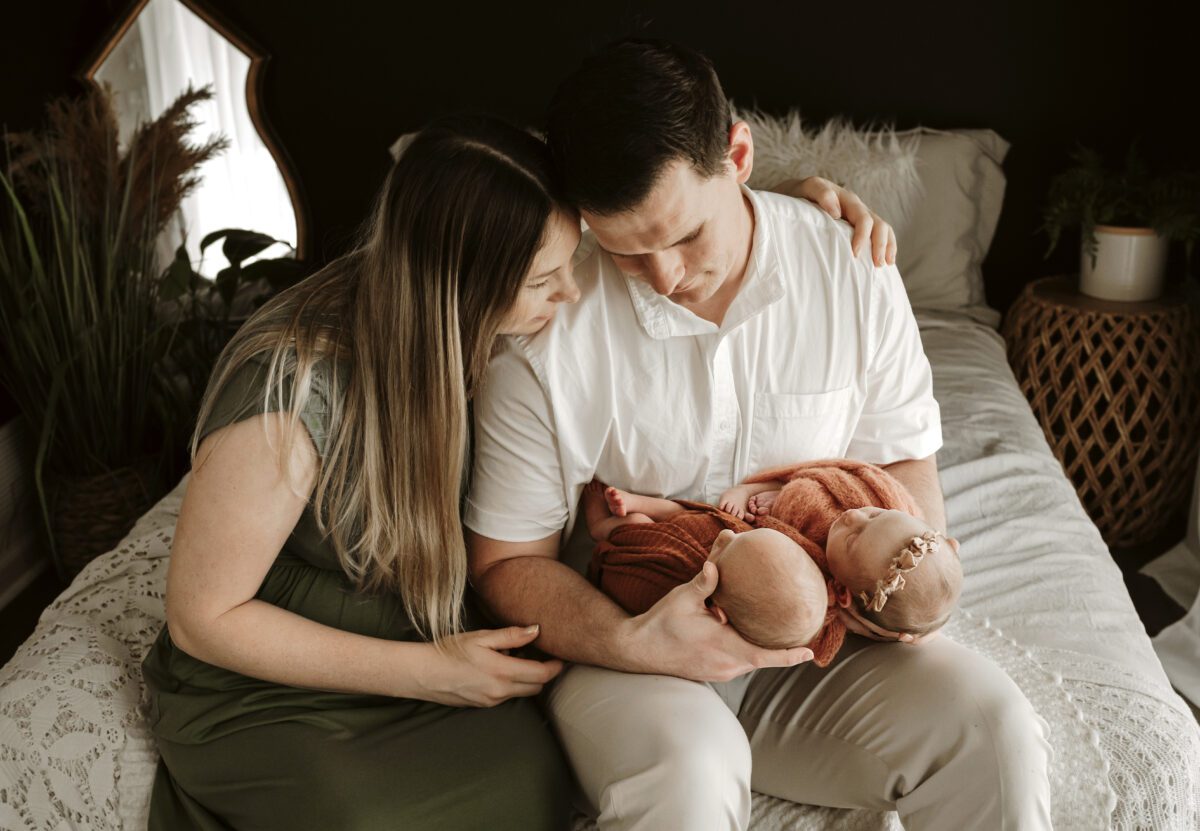 parents with twin newborn babies by Jen Jacobowitz Photography in Richmond VA