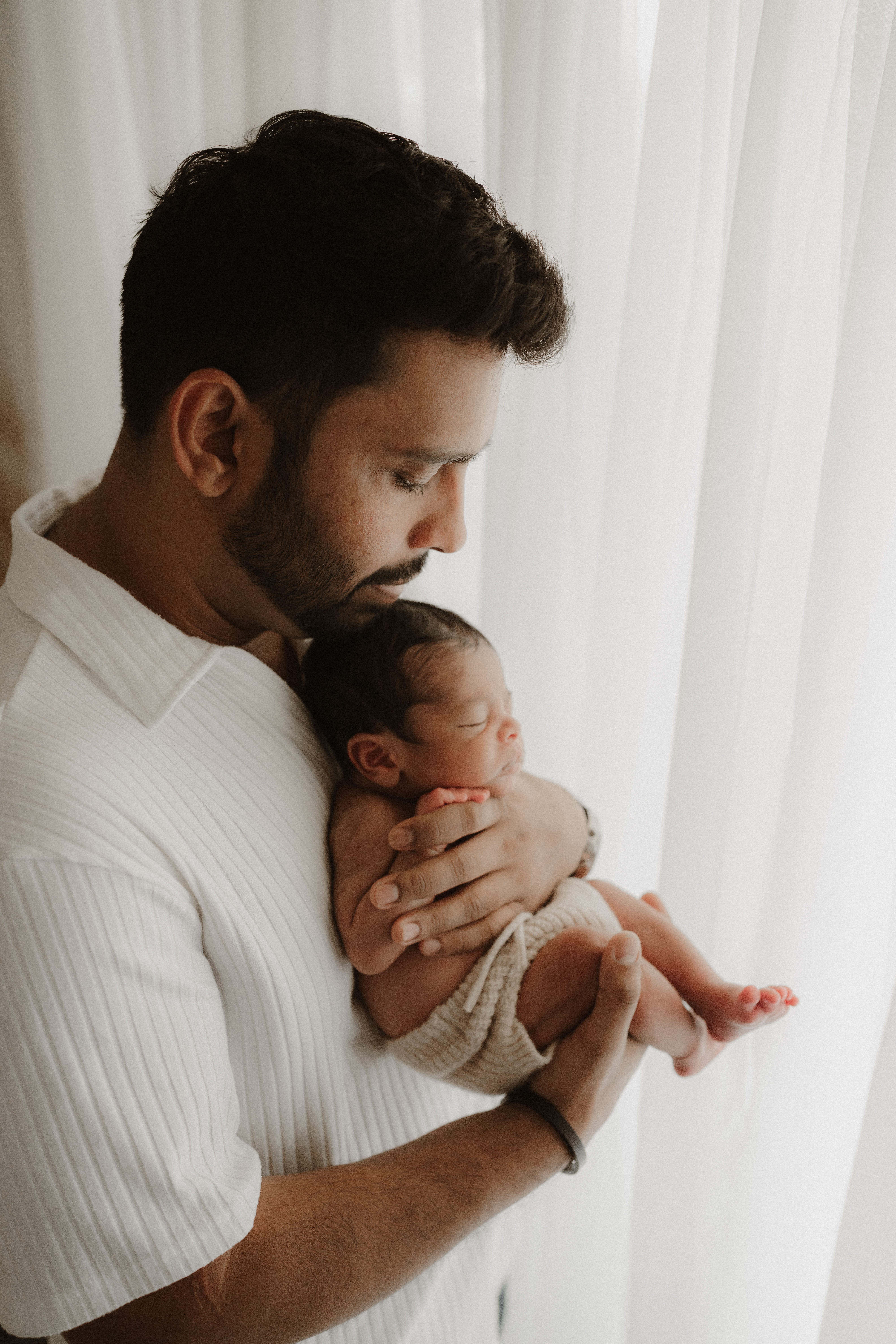 simple cream set up for dad and newborn session with Jen Jacobowitz Photography in Richmond VA