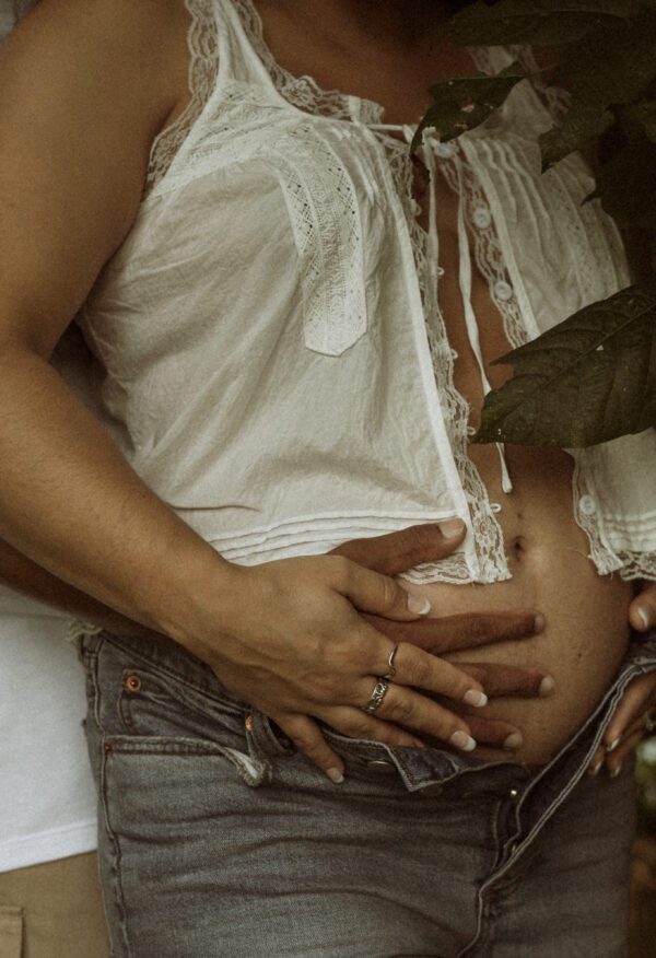 Outdoor maternity photography in Richmond VA with vintage tones and golden hour lighting