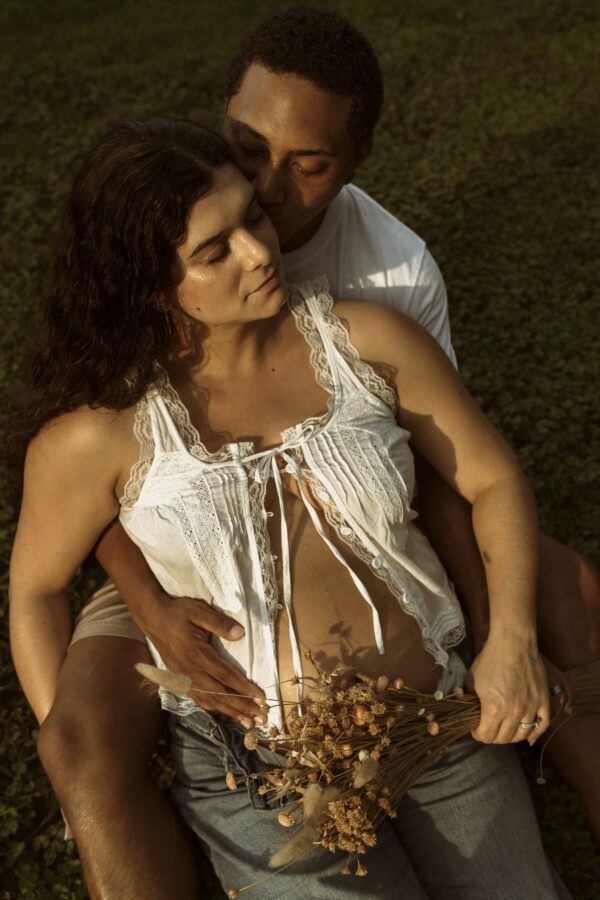 Outdoor maternity photography in Richmond VA with vintage tones and golden hour lighting