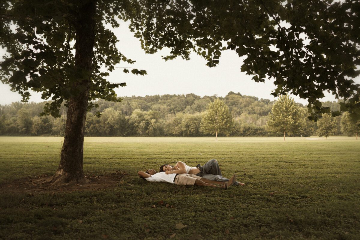 Outdoor maternity photography in Richmond VA with vintage tones and golden hour lighting