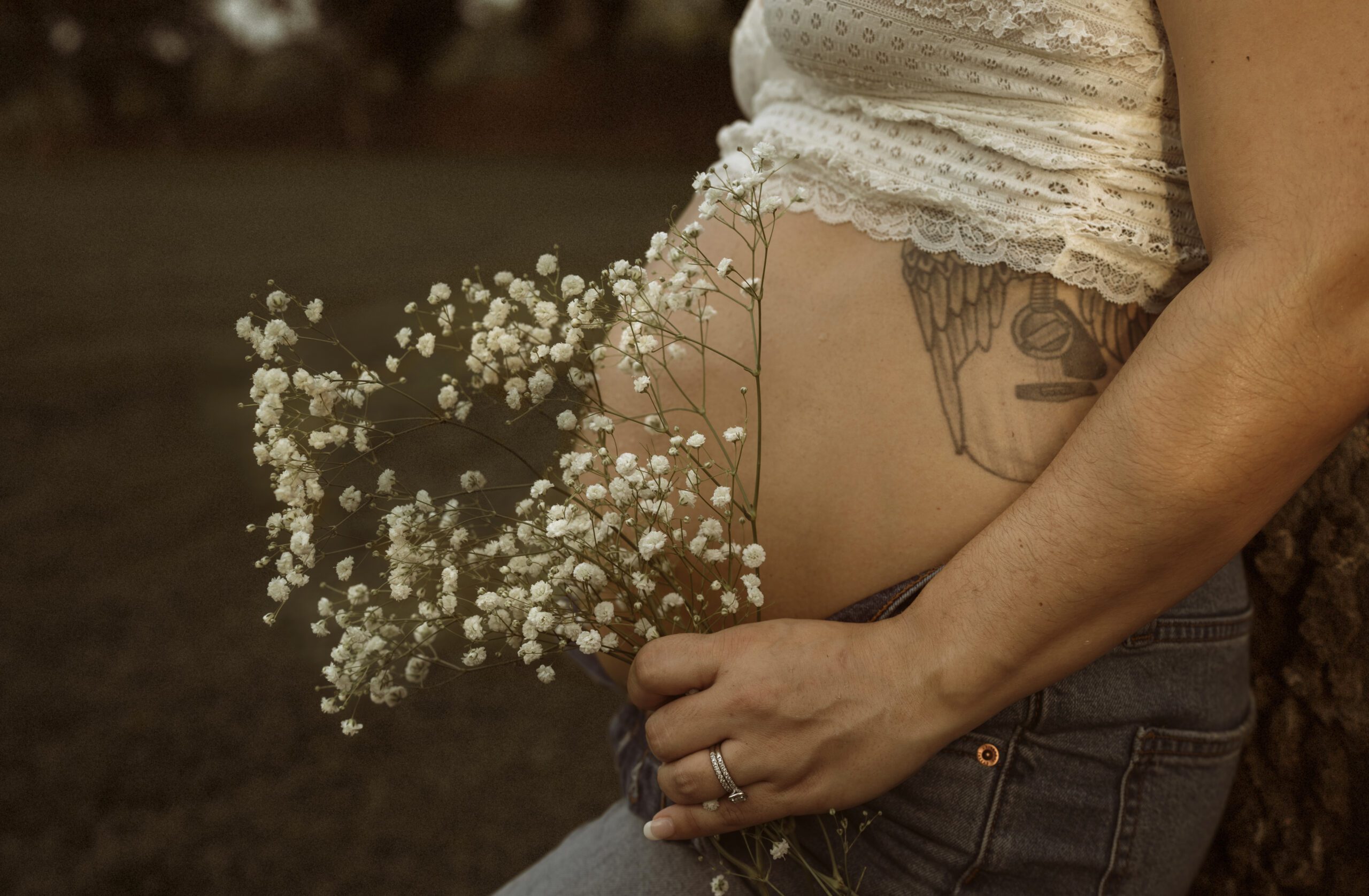 Outdoor maternity photography in Richmond VA with vintage tones and golden hour lighting